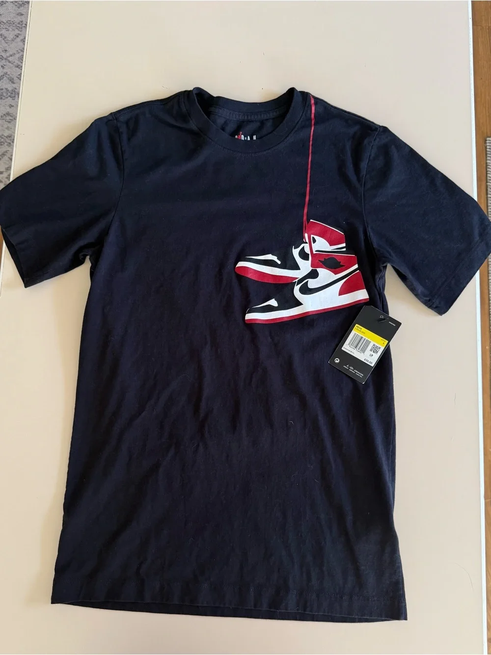 Jordan Men’s Black T‑Shirt with Red and White Sneaker Graphic